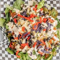 Southwest Salad · Fresh mixed greens topped with seasoned black beans, cheddar cheese, salsa, tortilla strips ...