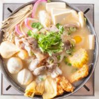 Japanese Miso Hot Soup · Taiwanese cabbage, pork slices, udon, enoki mushroom, clams, king oyster mushroom, fried tof...