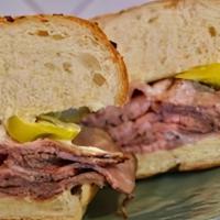 Steak Sandwich · Tri-Tip, Pepperoncini & Horseradish Mayo On Mustard Potato Bun Served With Onion Jus