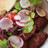 Falafel Salad · Lemon Vinaigrette, Hummus, Schug, Tehina Beets, Quinoa, and Pickled Red Onions