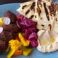 Falafel Plate · Saffron Rice, Hummus, Naan, Schug, Tehina Beets, and Pickled Vegetables