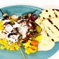 Chicken Souvlaki Plate · Saffron Rice, Hummus, Naan, Garlic Sauce, Israeli Salad, Feta, Schug and Pickled Vegetables