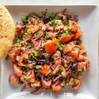 California Tomato Quinoa · Tomatoes, quinoa, red onions, kalamata olives, green onions, parsley, feta cheese with olive...