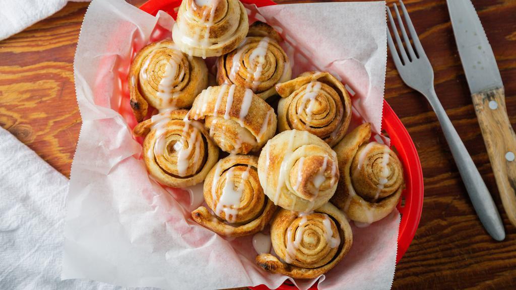 Cinnamon Sugar Rolls · Our dough stretched and braided, basted with butter, loaded with cinnamon & sugar. Baked to perfection then drizzled with marshmallow sauce.