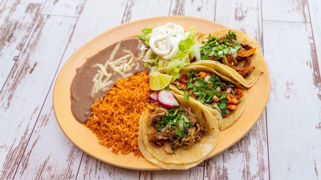 Three Taco Plate · Three soft tacos with your choice of meat topped with onions and cilantro.