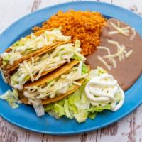 Three Crispy Taco Plate · Three hard shell tacos filled with your choice of meat, lettuce, cheese and sour cream.