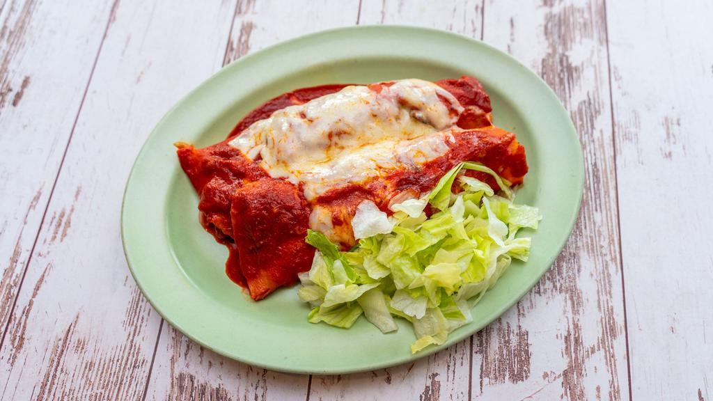 Enchiladas · Two enchiladas filled with your choice of meat smothered with our delicious red sauce, shredded cheese and served with lettuce.