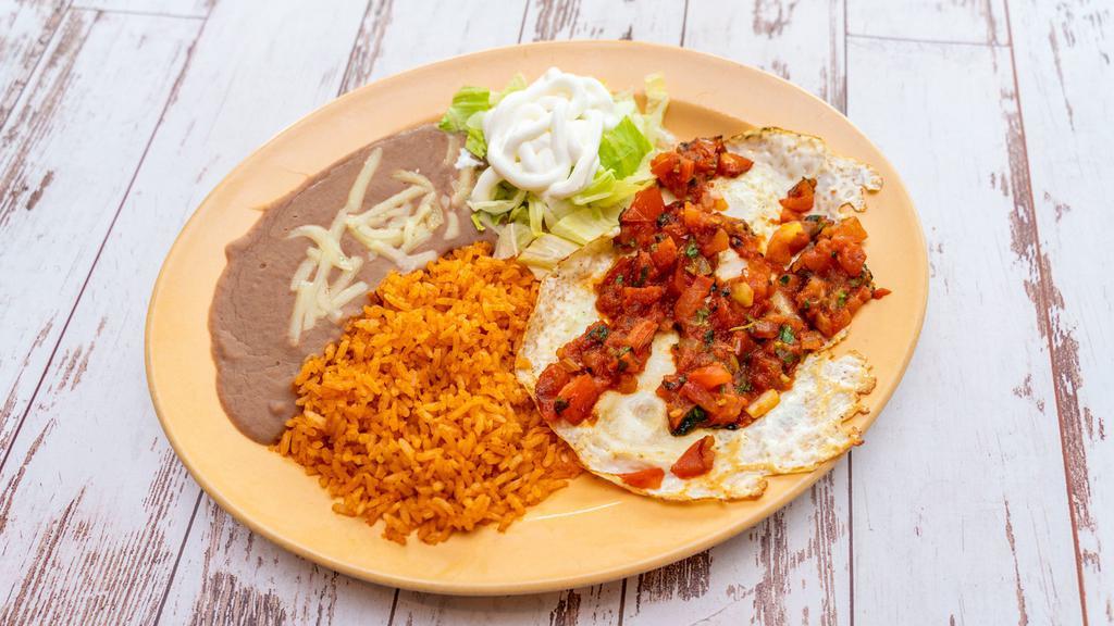 Ranchero Shrimp Plate · Shrimp cooked with bell pepper, onion and tomato served with beans, rice, lettuce and tortillas.