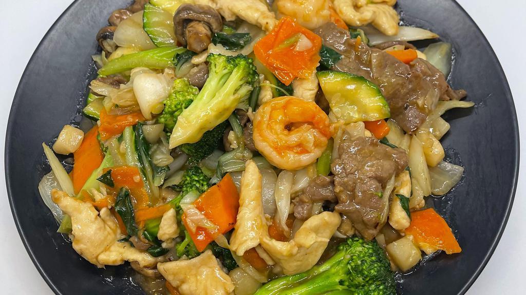 Happy Family · Combination of chicken, beef & shrimp sauteed with mixed vegetable in light brown sauce.