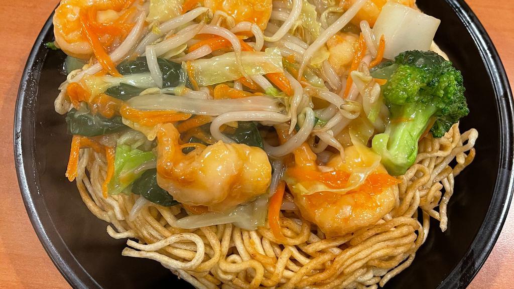 Double Pan Fried Noodles · Crispy pan fried noodles covered with mixed vegetables and meat.