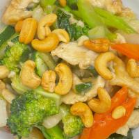 Cashew Chicken · Sliced chicken with mixed vegetables, cashew nuts in brown sauce.
