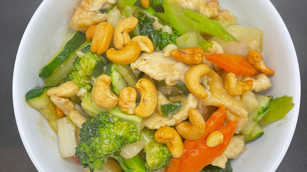 Cashew Chicken · Sliced chicken with mixed vegetables, cashew nuts in brown sauce.