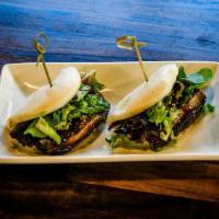 Chashu Bun (1Pc) · Steamed Bun filled with pork belly chashu, green onion, spring mix and sweet brown sauce