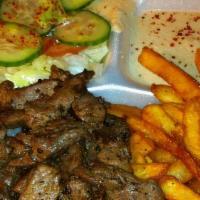 Shawarma Beef Or Chicken Plate · Served with rice, fries, hummus and salad.