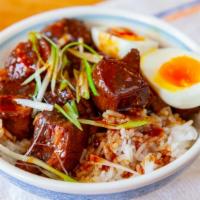 Lu Rou Fan · Slow-braised pork belly, ginger, shallots, herbs, roast garlic, soft-boiled egg, rice.