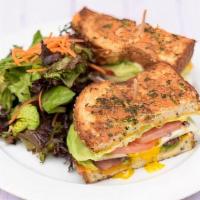 Grilled Breakfast Sandwich · Over medium eggs, uncured bacon, avocado, red onion, tomato, lettuce, mayo, Cheddar cheese o...