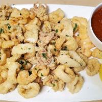 Fritto Di Calamari E Gamberetti · Deep-fried baby calamari and rock shrimp served with marinara sauce.