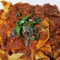 Tagliatelle Alla Bolognese · Fresh homemade pasta tossed in a classic bolognese-style ragout.