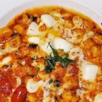 Gnocchi Alla Sorrentina · Homemade potato dumplings tossed with tomato ragout, fresh mozzarella and basil.  Gluten fre...