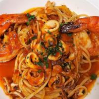Linguine Alla Luciana · Jumbo prawns and baby calamari sautéed with white wine and garlic in a zesty tomato sauce.
