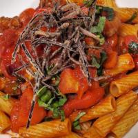 Rigatoni Alla Siciliana · Italian sausage and eggplant ragout in a zesty tomato sauce garnished with fried eggplant sk...