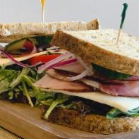 Black Forest Ham Sandwich      · Black Forest Ham, American Swiss American Cheese, Avocado, Red Onion, Tomato, Baby Greens, B...