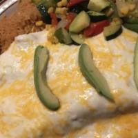 Seafood Enchiladas · Two flour tortilla enchiladas  filled with shrimp, bay scallops, imitation crab meat, and me...