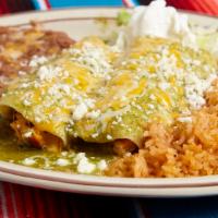 Enchiladas Suizas · 2 Enchiladas filled with grilled chicken & cheese. Topped with our famous verde Suiza sauce....