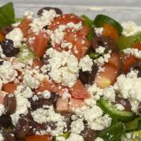 Greek Salad · Romaine Lettuce, Tomatoes, Cucumbers, Olives, Feta Cheese and a side of your choice dressing.