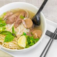 Meat Lover Pho · Beef broth, rice noodles, rare steak, meatballs (beef), brisket, bean sprout, lime, green on...