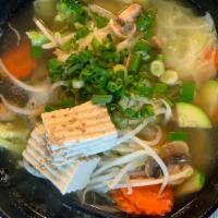 Vegan Ramen · Mushroom base broth, vegan ramen noodles, carrot, tofu, mushroom, cabbage, yellow onions, zu...