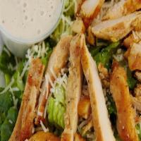 Chicken Caesar Salad · Crisp romaine lettuce, Parmesan cheese, caesar dressing, topped with fresh grilled chicken b...