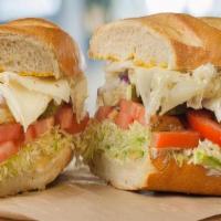 The Veggie · Fresh sliced avocado, lettuce, tomatoes, red onion, pickles, provolone cheese, mustard and m...