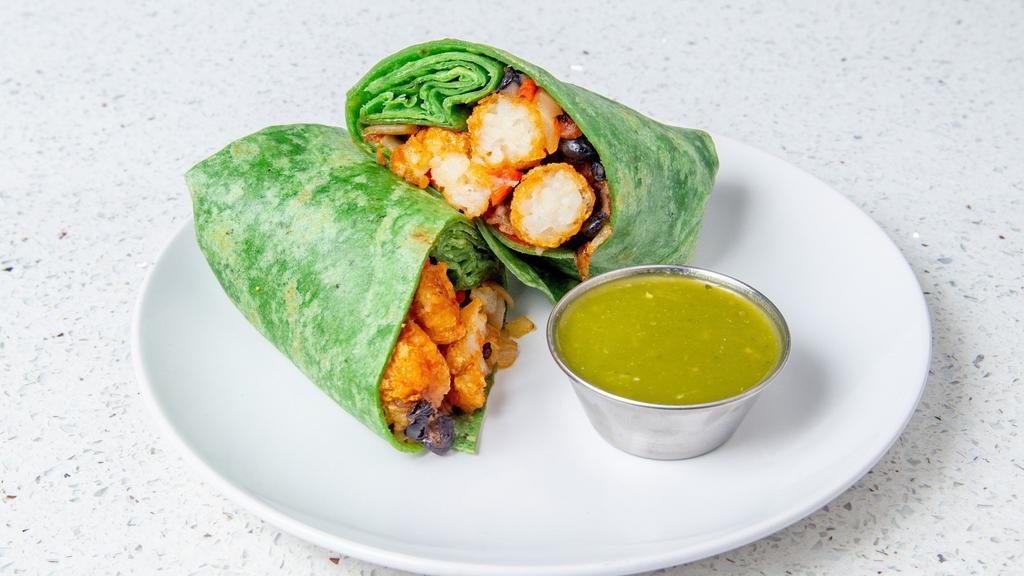 Vegan Burrito · Black beans, tater tots, onion, roasted bell pepper, tomato and scallions in a flour tortilla with homemade salsa Verde.