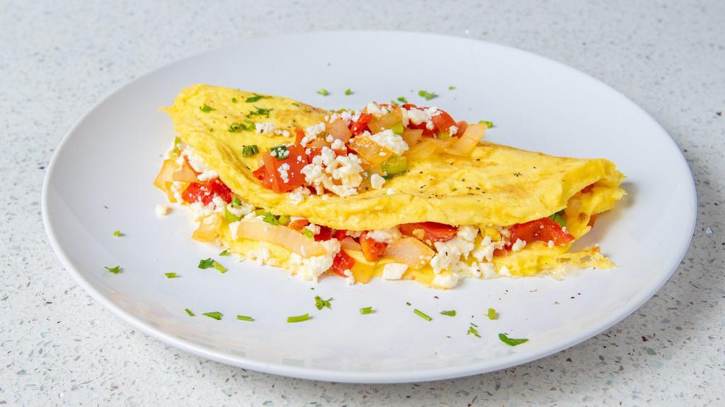 Mediterranean Omelet · Three eggs, feta cheese, roasted bell peppers, tomato, scallions, onion.