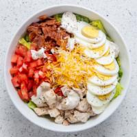 Cobb Salad · Herb roasted chicken breast, bacon, two hard-boiled eggs, cheddar jack blend cheese, tomato,...