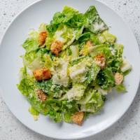 Caesar Salad · Crisp Romaine lettuce, Caesar dressing, house made croutons, shredded parmesan.