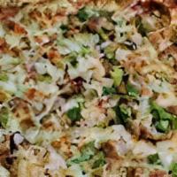 Scoreboard Pizza · Pepperoni, Italian sausage, Canadian bacon, green pepper, onions, black olive, and mushroom.