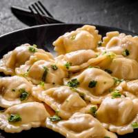 Beef Ravioli · Fresh ravioli cooked with your choice of sauce, veggies, and meats and topped with black pep...