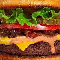 Classic Burger · American beef patty topped with lettuce, tomato, onion, and pickles.