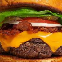 Bacon Burger · American beef patty cooked medium rare and topped with melted cheese, crispy bacon, lettuce,...