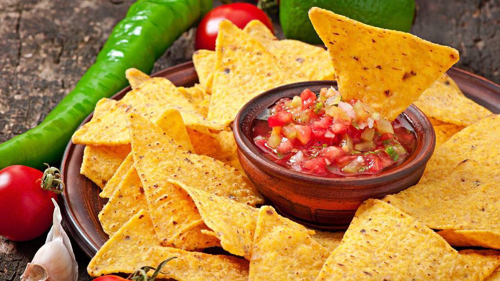 Chips And Pico De Gallo · Delicious chips served with pico de gallo made from fresh tomatoes, onion, cilantro, lemon, and lime.