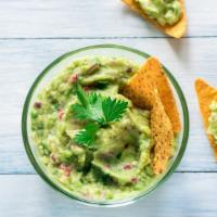 Chips And Guacamole · Delicious chips served with fresh guacamole made from avocado, tomatoes, onion, cilantro, ja...