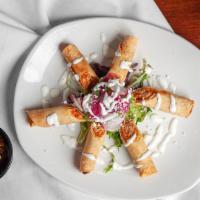 Two Chicken Taquitos · Served with rice and a small fountain