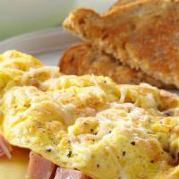 Scramble Egg Breakfast · 3 eggs with shredded cheese and your choice of two proteins (ham, bacon, sausage, or chorizo...