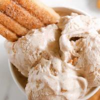 Churro Ice Cream · Three scoop of vanilla Ice Cream Churro and your choice of chocolate or caramel drizzle and ...