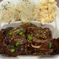 Kalbi Short Ribs · 3 pieces of short rib with sesame seeds and green onions over furikake seasoned rice and mac...