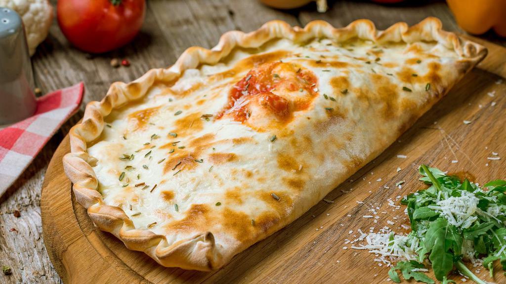 Chef'S Cheese Calzone · Fresh ricotta cheese oven-baked calzone, served with side of marinara sauce.