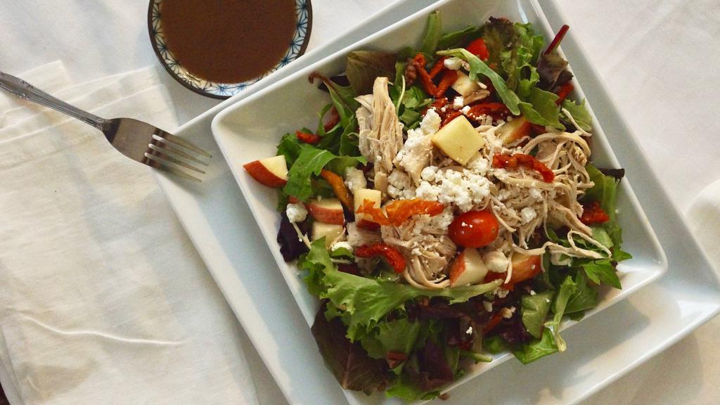 Chicken & Apple Delight Salad · Mixed greens, sun-dried tomatoes, goat cheese, cherry tomatoes, chicken, walnuts and apples with balsamic dressing.