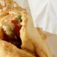 Chicken Shawerma Pita Wrap · Marinated and flame broiled chicken, tomatoes, lettuce, garlic sauce, pickles.